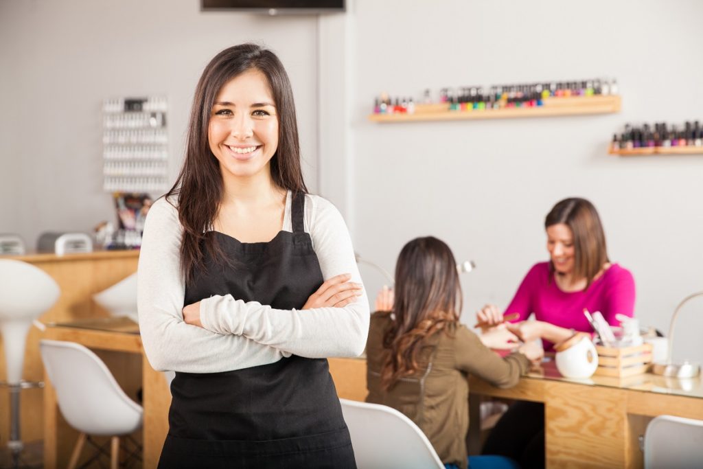 Business owner posing with her arms crossed