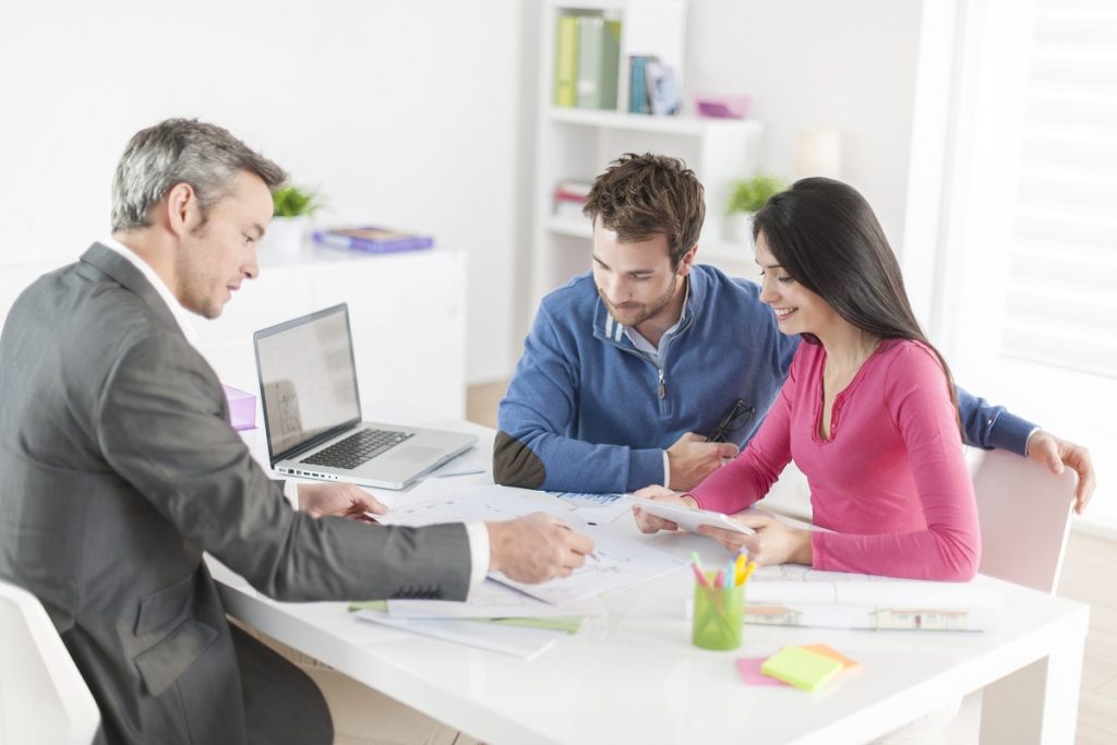 Couple with real estate agent